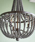 Dumas 16"W 3-Light Golden Bronze Finish Distressed Gray Wood Bead Chandelier by KenroyHome